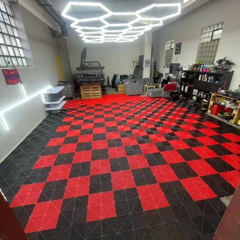 Garage with a red and black checkerboard tile floor